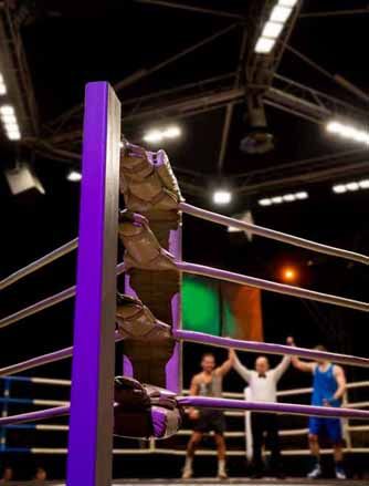 MMA fighters compete in a boxing ring